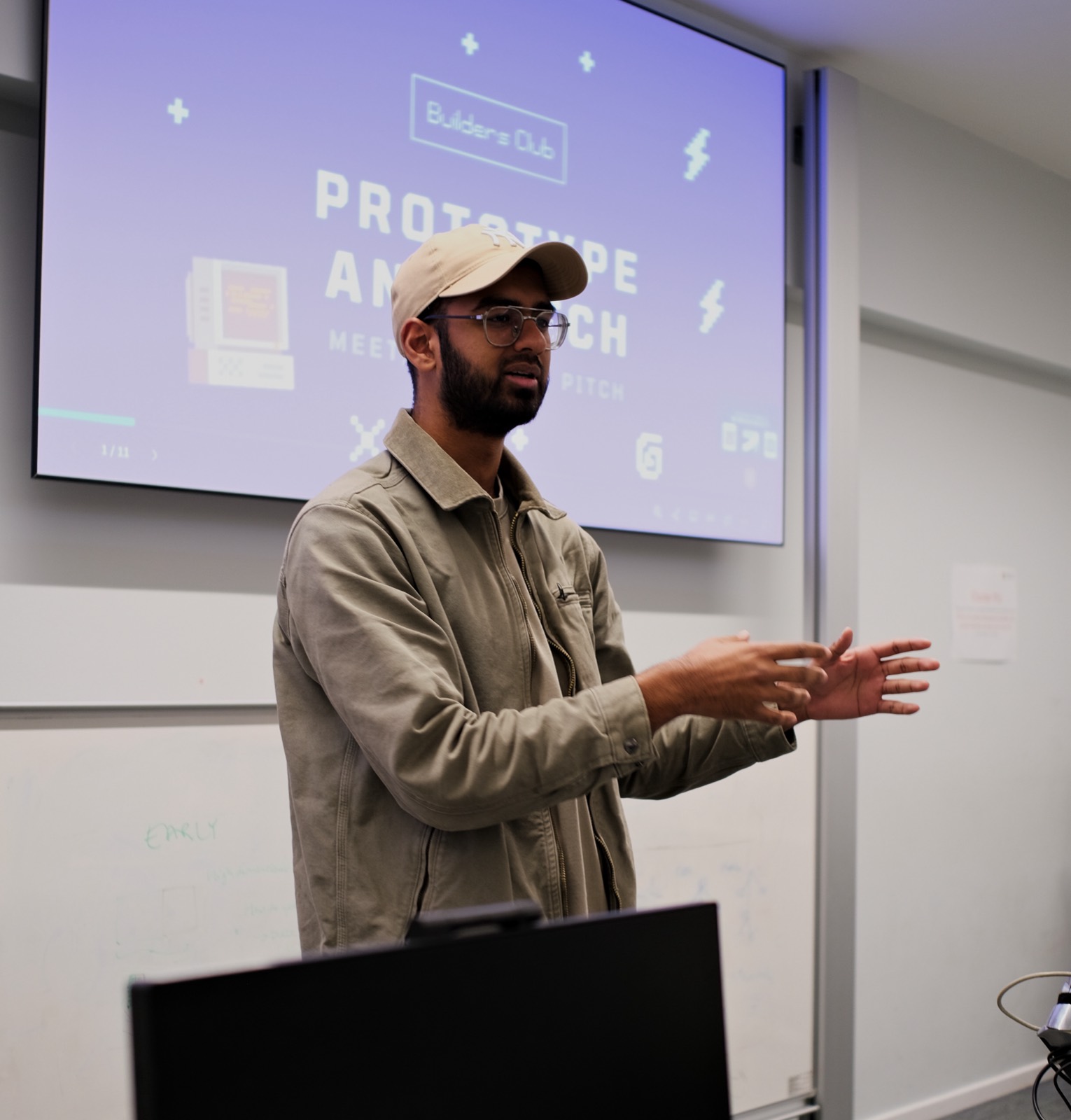 A member briefing the room at the start of a build